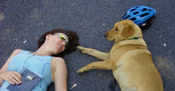Lisa rests with a new friend after a multi-sport race.