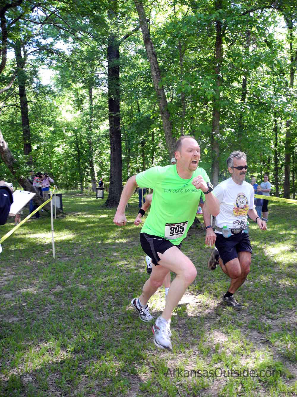 A runner giving the crowd a good show at the finish.