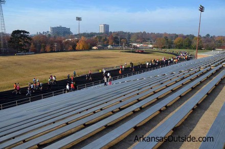 Track Runners make their way around the track and across a field.