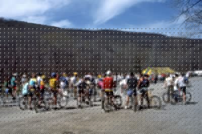 Cyclists watching the "Log Pull" event.