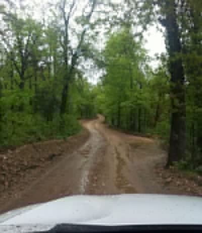 Wet, muddy, lonely road.
