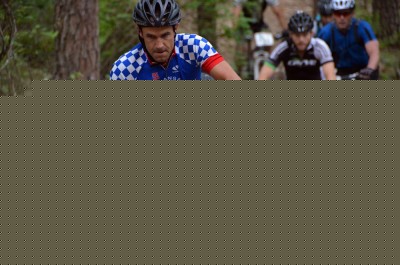 Climbing past the big rock shortly after getting on the singletrack.