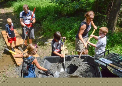 Showing the kids how the business end of a shovel works during a recent trail work day.