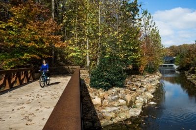 A rider on the Razorback Greenway in Bentonville, Arkansas, outside the Crystal Bridges Museum of American Art. (Bike NWA)
