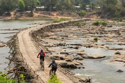 Rebecca Rusch and Huyen Nguyen ride the Ho Chi Minh Trail for the feature film project 'Blood Road' in Vietnam, Laos, and Cambodia in March, 2015. Project / Event: