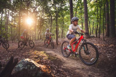 Young family mountain biking at Pinnacle Mountain State Park