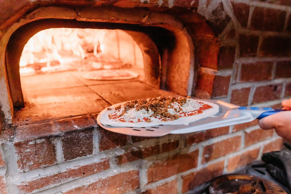 Another pizza, going into the oven.