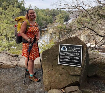 Arlette Laan stands at the Ice Age Trail's western terminus. Once she reaches the trail's eastern terminus, she'll be the first woman to hike all 11 national scenic trails. Photo courtesy of Arlette Laan