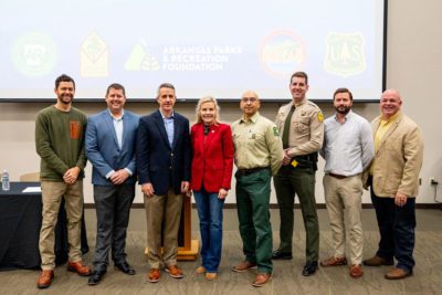 From left to right: Arkansas Parks and Recreation Foundation Trail Project Manager Mitchell Allen, Mena Mayor Seth Smith, State Rep. John Maddox, Arkansas Department of Parks, Heritage and Tourism Sec. Stacy Hurst, Ouachita National Forest Acting Deputy Forest Supervisor Felipe Cano, Queen Wilhelmina State Park Superintendent Dru Edmonds, Arkansas State Parks Deputy Director Jeff King and Arkansas State Parks Director Shea Lewis.