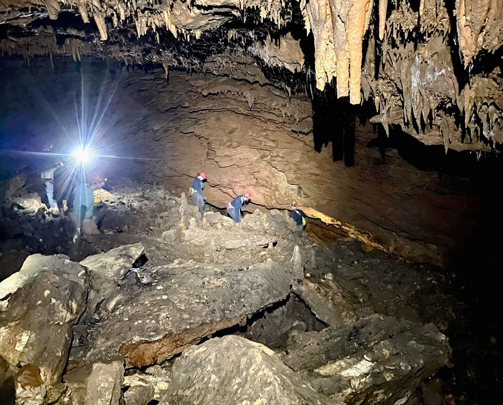 Students learning caving skills.