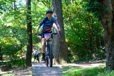The Second-Annual Women of OZ Sunset Summit offers a well-rounded experience with clinics and workshops, wellness programming, a shopping hub, and more. BENTONVILLE, Ark. (August 1, 2023) - The Women of OZ (WOZ) Sunset Summit fundraiser returns to Bentonville, Arkansas, this fall as the world’s largest women’s mountain biking summit with a weekend full of workshops led by experts and supported by nationally recognized cycling brands. The WOZ Sunset Summit will get women on bikes all weekend at the Momentary Green on September 15-17, 2023. Kicking off with a welcome celebration on Friday evening, September 15, at the Momentary, guests will be introduced to Amber Bynum, Vice President, Health & Wellness Sourcing at Walmart, serving as the Honorary Chair for the 2023 Sunset Summit. Opening reception attendees can hear from event organizers and peruse Engel & Volker's WOZ ReSet, the Summit’s shopping hub of cycling gear and local goodies. ReSet partner vendors include FOX, Wild Rye, Rapha, Buckhorn, Sunny’s on Second, LIVSIN, Oracle Oasis, Specialized, Bearded Goat, Deena Eckel – Jewelry, and the Meteor Bike Shop. WOZ ReSet will be open in the Momentary courtyard throughout the weekend during the following hours: • Friday, September 15 | 1 p.m. - 5:30 p.m. • Saturday, September 16 | 8 a.m. - 4:30 p.m. • Sunday, September 17 | 8 a.m. - 1 p.m. On Saturday, attendees will connect and build their skills and confidence through a plethora of expert-led clinics and workshops. In addition to the roster of 34 professional coaches from across the country, the USA Cycling women’s group will be in attendance alongside new workshop presenter Cari Higgins, 23x National Champion and the first woman to hold a leadership position on the USA Cycling Board of Directors. Other programming events available include: • Panel: Anita Naidu -Anti Racism and Inclusion panel with Bike.POC, Marley Blonsky (All Bodies on Bikes), and Jacyln House (Good Day NWA) • Meditation Workshop, presented by Sunny’s on Second • How to Maintain Your Pelvic Floor, presented by Renew Physical Therapy • Taking Lead, Harnessing Courage and Confidence, presented by Skills Lab • Bike Maintenance, presented by NorthWest Arkansas Community College (NWACC) Mechanic school • Ride Prep 101, presented by Wild Rye • Air Bags, presented by Gravity NWA • What Did I Get Myself Into? All the Questions Answered for Beginners, by USAC's Cari Higgins • Women’s Health Discussion by Dr. Hurptz from Salt Health • Learn to Wheelie • Nutrition • Bike Travel and Bikepacking In the evening, participants will reconvene for a Sunset Party on the rooftop of Ledger, the first-ever bikeable building with six stories of exterior switchbacks. Attendees will enjoy a champagne toast together followed by dinner and a party on the sixth floor. Partygoers will also hear a special keynote entitled “How to Win When You Don’t” from 2x Olympian and cross-country mountain biker, Lea Davison, who is participating in this year’s WOZ Sunset Summit as a coach. Davison will discuss her quest for a third Olympics and putting her all into qualifying for Tokyo. Lea will talk about the tactics used to pick herself up after not being selected for the team, and how others can cope with feelings of failure. Additional tickets for those who are not participating in the WOZ Sunset Summit are available for $75 online. After a long day of riding and skills workshops, attendees are welcome to relax and reset in the Boiron WOZ Recovery Lounge with wellness amenities provided by Arnicare, Blake St, and Restore Wellness. The Recovery Lounge will be located at the Momentary and available to all attendees throughout the weekend. Tickets to the WOZ Sunset Summit include admission to the three-day event, entry to the opening reception Friday night, food, and drinks on Saturday, one ticket to the Sunset Party at Ledger, and more. Attendees will also have the chance to win a custom-painted Allied BC40 bike frame, valued at $5,000, in a raffle by Allied Cycle Works. In addition to WOZ Sunset Summit tickets, attendees can purchase additional items this year to enhance the WOZ Sunset Summit experience. • Blake Street-Special Weekend Wellness Pass | $50 • OZ Art NWA Bike Tour, finishing with a cocktail hour at The Tower Bar | $50 • Specialized Bike Rental | $125 for the full weekend • Afternoon group ride excursions| $40 each • Additional tickets to the Sunset Party at Ledger | $75 each or a Party Pack of 8 • FORMAT Festival One Day Ticket for Sunday, September 24 | $75 (Full value $144.03); includes a limited-edition WOZ sticker WOZ Sunset Summit is the organization’s largest fundraiser of the year, aimed to get more women on bikes and break down barriers. One of the biggest hurdles is education, so the summit brings together top industry leaders and the best coaches in the world for a weekend of rides, clinics, workshops, and discussions to build confidence and community. The weekend’s fundraising efforts support programming throughout the year to get more women on bikes and, in turn, help women find their community. To learn more about WOZ Sunset Summit or purchase tickets, please visit the WOZ Sunset Summit website.