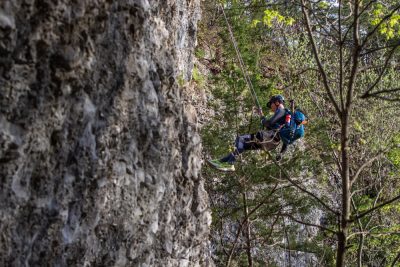 Abseiling down a cliff at Expedition Ozark.