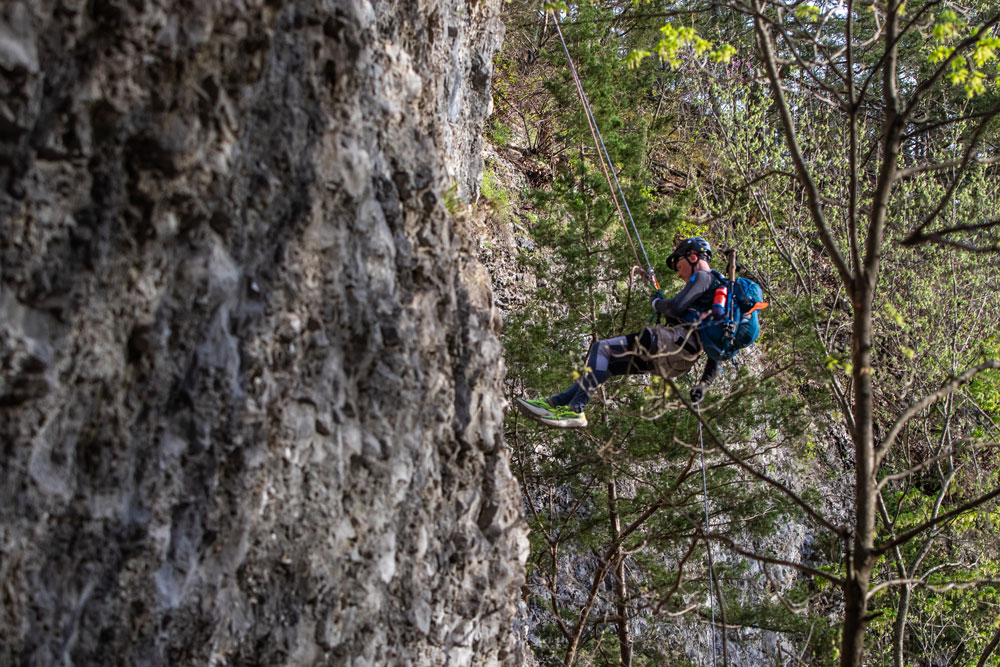 Abseiling down a cliff at Expedition Ozark.