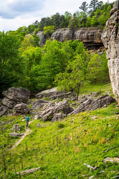 A mountain biker is almost lost in the big scenery at Horseshoe Canyon Ranch.