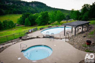 The pool and hot tub have a wonderful view of the Ozarks.