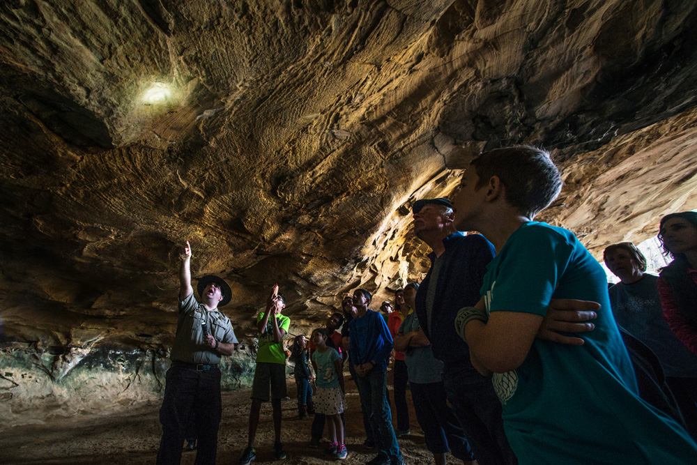 Pointing out cave art at Petit Jean State Park.