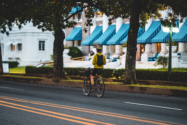 In the 2022 Ouachita Triple Crown, an unidentified rider pedals down Bathhouse Row. Photo by Kai Caddy.