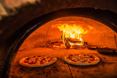 Pizzas baking at Oven & Tap.