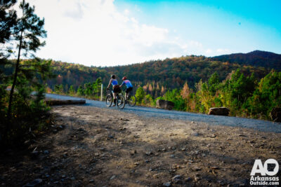 Riders heading across the dam from the trailhead.