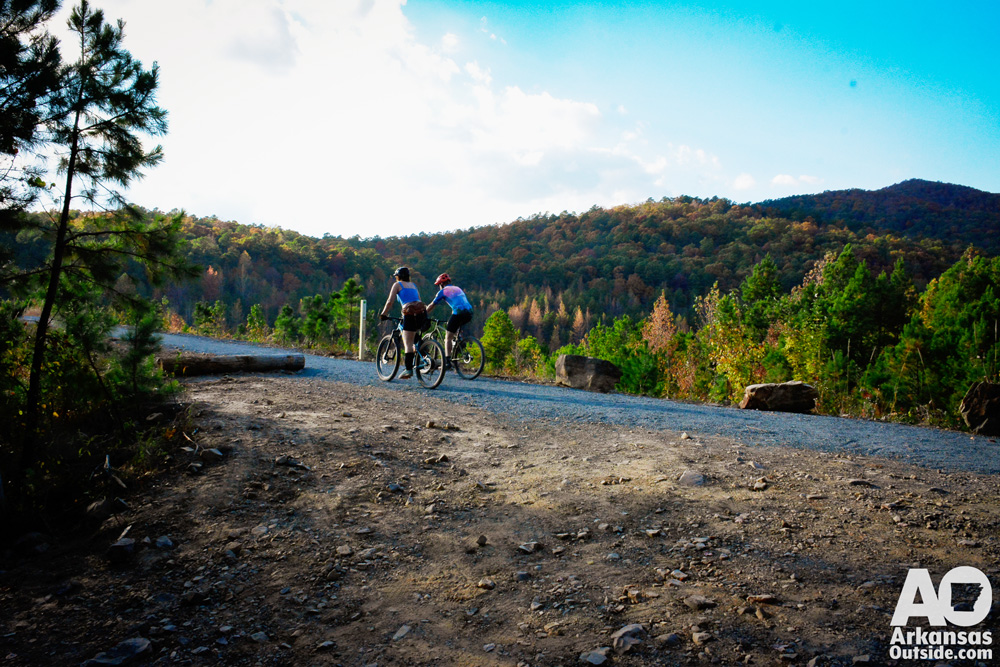Riders heading across the dam from the trailhead.