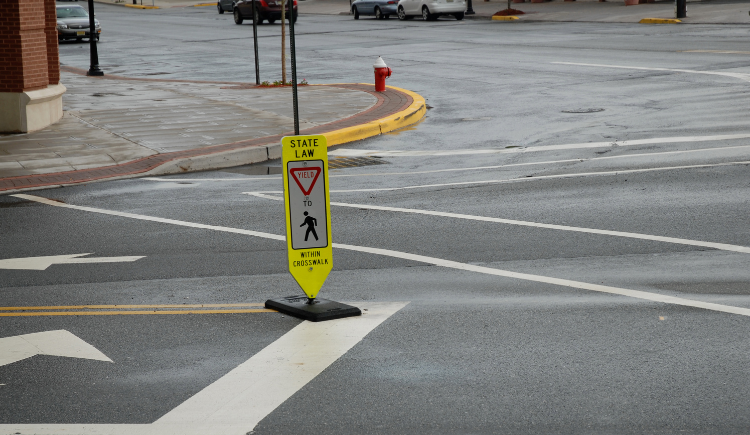 To ensure pedestrian safety, drivers should slow down or stop, as necessary, to allow pedestrians and cyclists to cross safely.