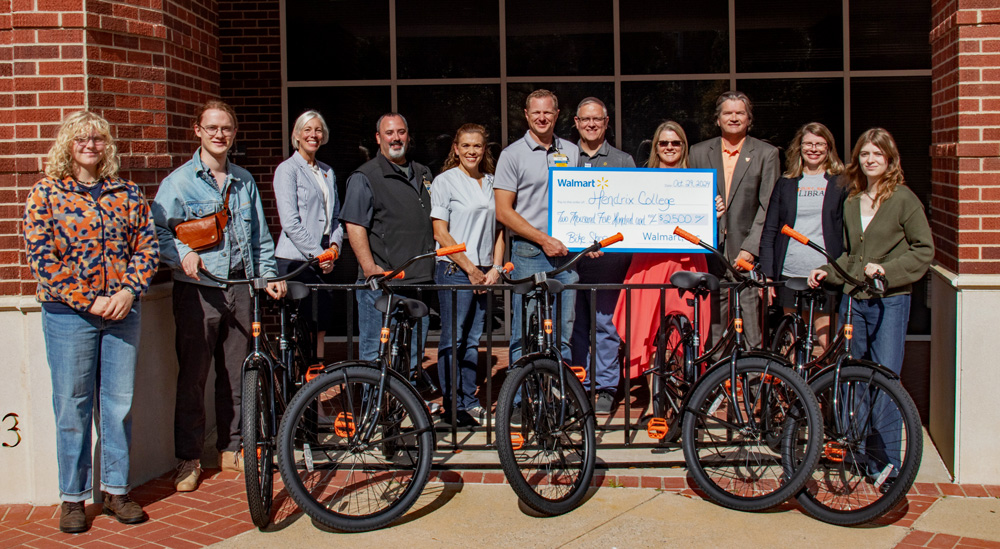 Members of the Hendrix Bike Revolution student organization, Bailey Library faculty, and Hendrix administration gather with Walmart representatives to celebrate the new bicycles ready for use by Hendrix students. From left: Avery Meyer ’28, Ted Bjurlin ’25, Hendrix Vice President for Advancement Meredith Brunen; local Walmart managers Gary Nason, Andrea Newman, and Ryan Peters; Michael Lindsey of the Walmart Foundation; Hendrix President Karen Petersen, Assistant Vice President for Development Ben Carter, Director of the Library Britt Anne Murphy, and Amelia Lindsey ’25.