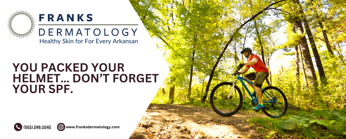 A mountain biker wearing a helmet and red shirt rides along a sunlit forest trail. Text on the left reads, “FRANKS DERMATOLOGY – Healthy Skin for For Every Arkansan. YOU PACKED YOUR HELMET… DON’T FORGET YOUR SPF.” Contact information and website are also included.