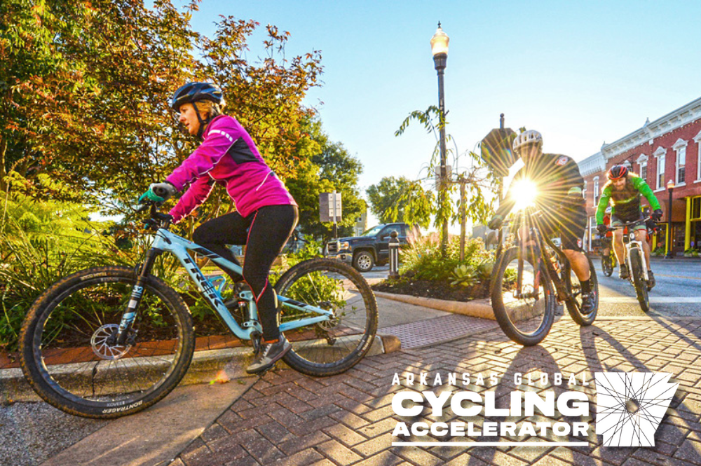 Cyclist riding in downtown Bentonville. Arkansas Global Cycling Accelerator