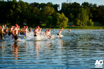 Triathletes starting the swimming leg of a triathlon.