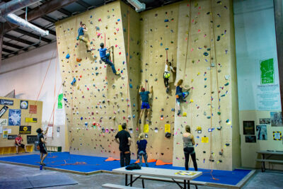 Climbers getting experience in indoor climbing gyms.