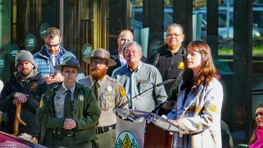 Katherine Andrews, the Director of the Arkansas Office of Outdoor Recreation speaking at the ribbon cutting for the Pinnacle Mountain State Park Visitor Center in 2023. Arkansas outdoor recreation economy