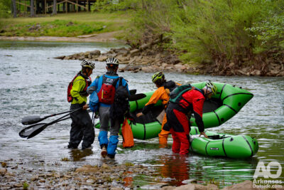 Teams working out strategies before getting on the river.