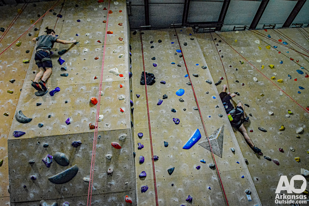Young climbers working separate routes during the Central Arkansas Regional Championships last month at Little Rock Climbing Center.