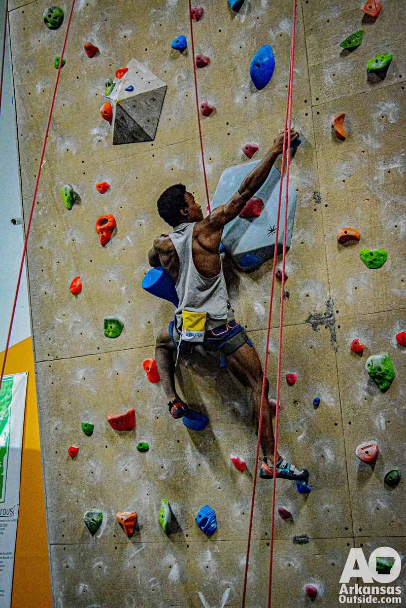 Another climber working a problem on a tough route.