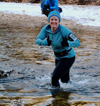 Berry crossing Sylamore Creek in the middle of winter during the Sylamore 25K/50K Trail Run.