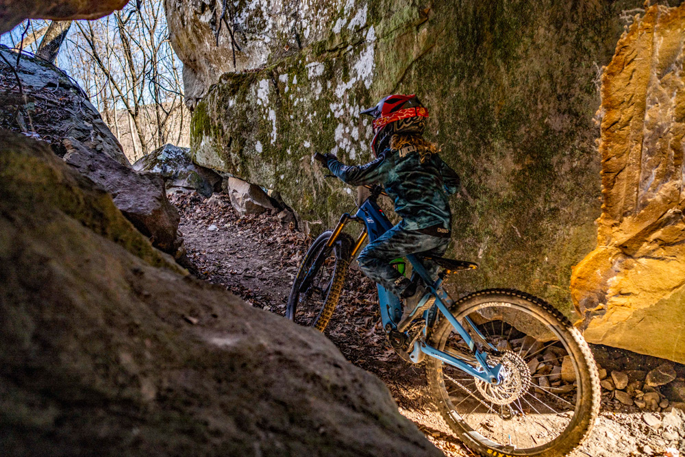 Slipping through the rocks.