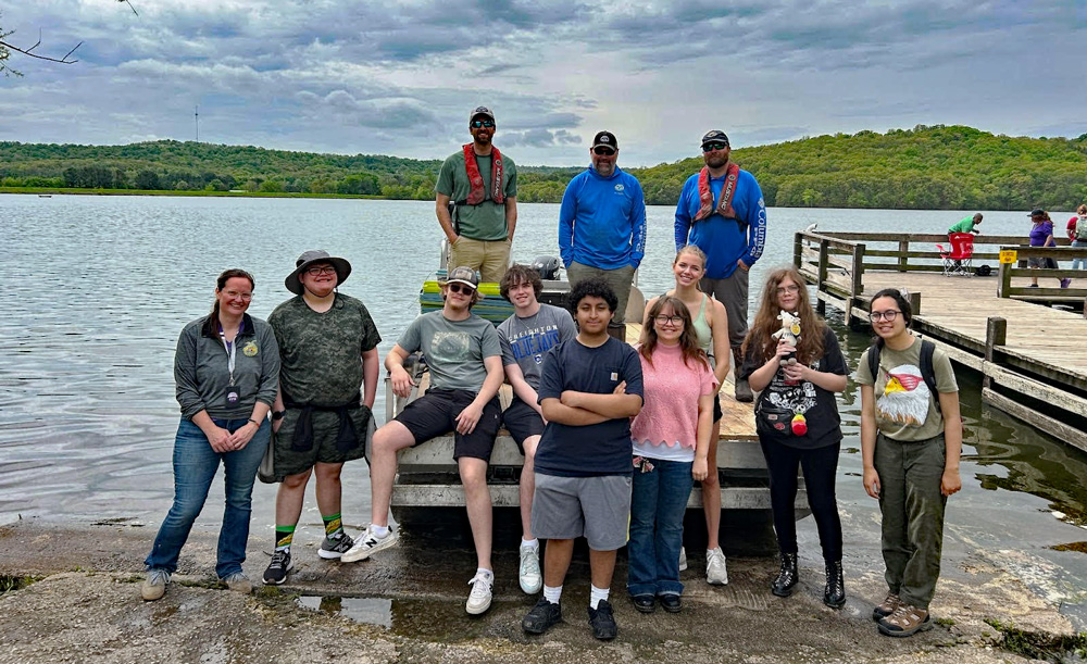 Students from Har-Ber High School in Springdale and Fayetteville High School transplanted native plants to cages in Bob Kidd Lake as part of a larger school-based initiative. AGFC photo. Northwest Arkansas schools conservation project