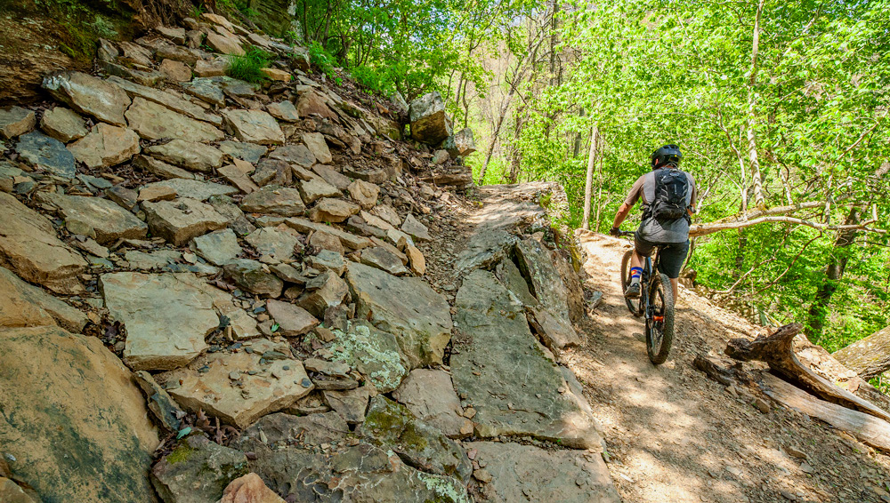 Riding the Devil's Racetrack at Devil's Den State Park. This trail is also open to hiking.