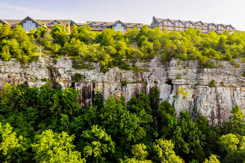A state park lodge along the top of a high bluff line.