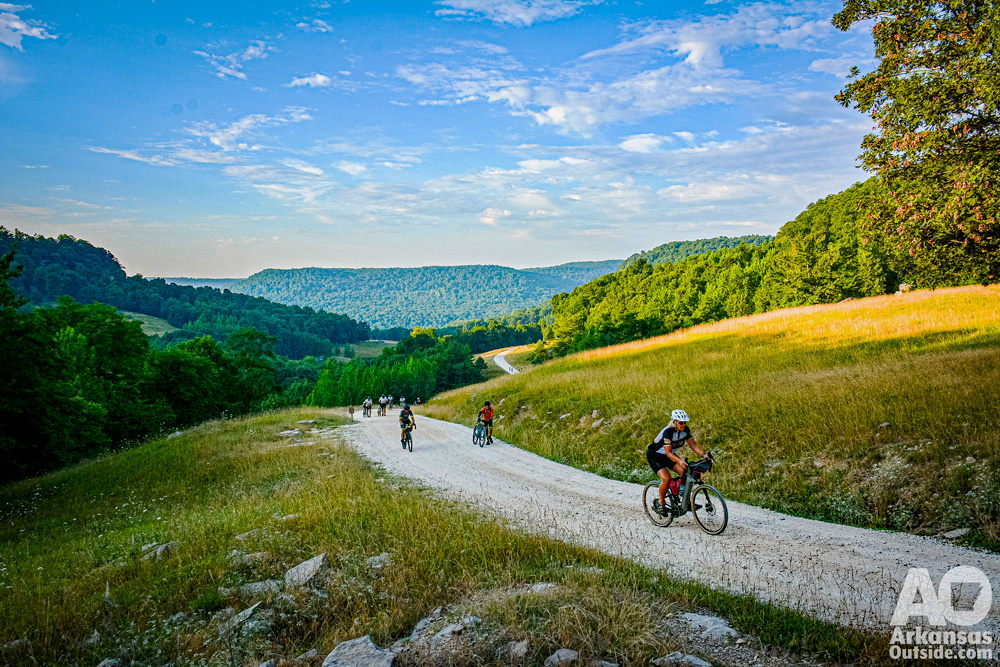 Gravel cyclists climbing gravel road out of Horseshoe Canyon.