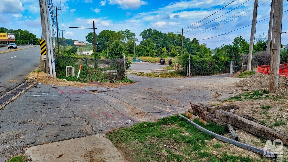 Transition from the sidewalk in front of Dillard's Headquarters and the Gill Street Bridge.