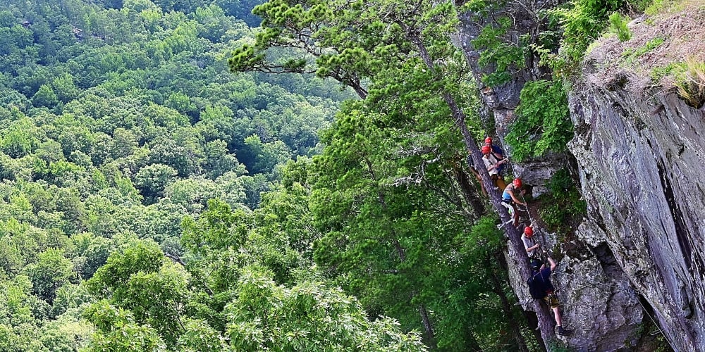 Climbers below an overlook at Petit Jean State Park.