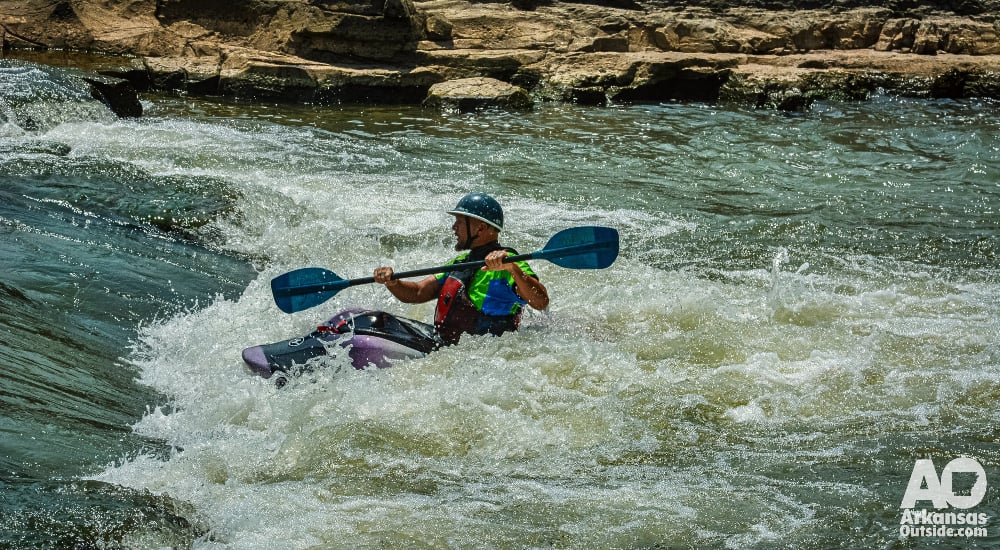 Kayak surfing.