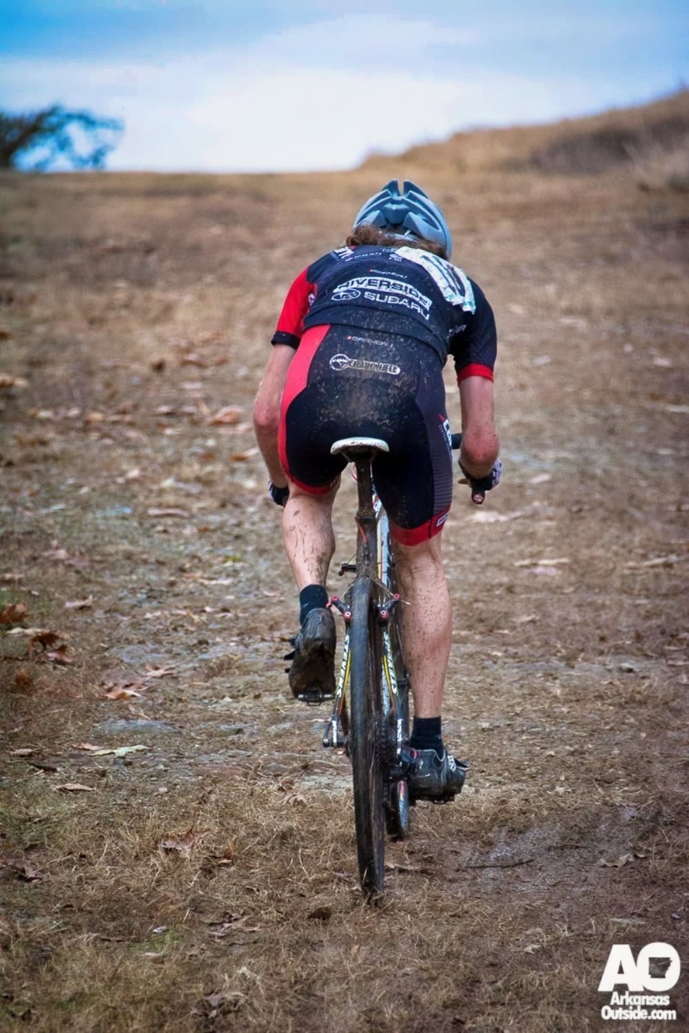 Riding away.