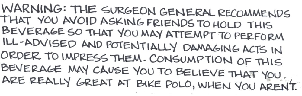 Close-up of the warning label. We were all having a great time playing bike polo at the time.
